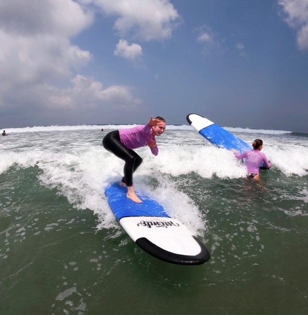 Girl surfing in Bali