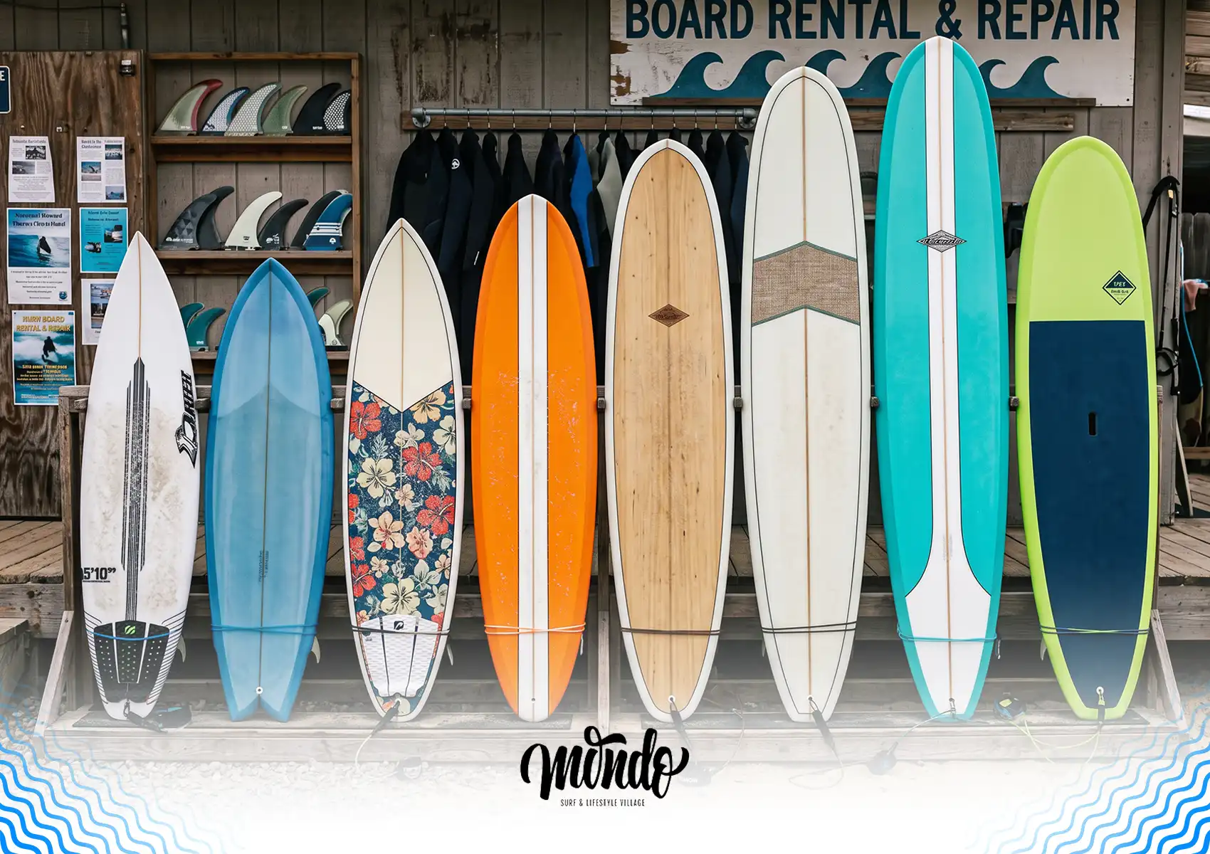 A colorful selection of different types and sizes of surfboards lined up on a rack outside a board rental and repair shop at a surf camp bali.